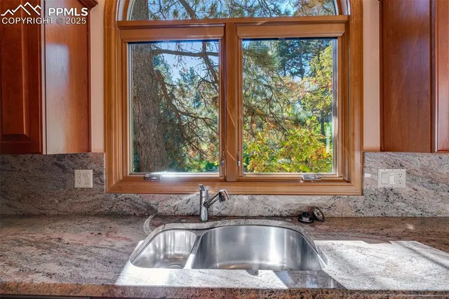 a kitchen sink sitting next to a window
