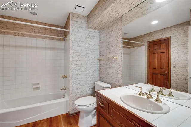 a view of an empty room with windows