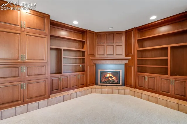 a big room with large windows and a bed