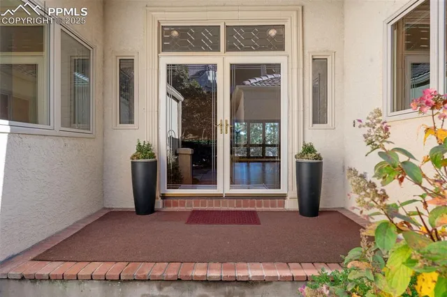 a view of porch with a bench in front of house