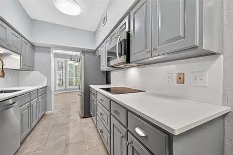 a front view of a building with a garden