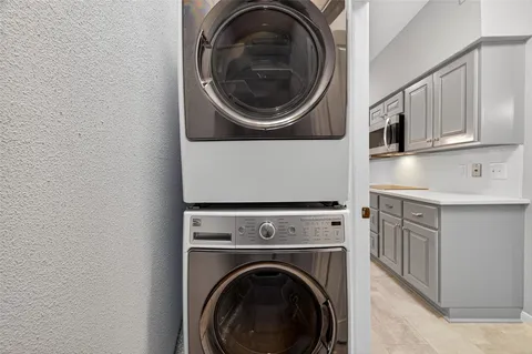 a front view of a residential apartment building with a yard