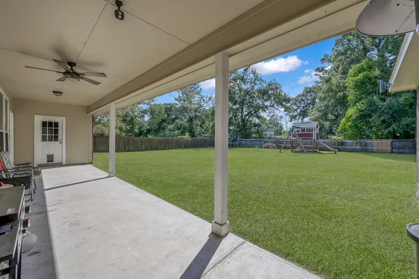 a kitchen with stainless steel appliances granite countertop a refrigerator sink and stove