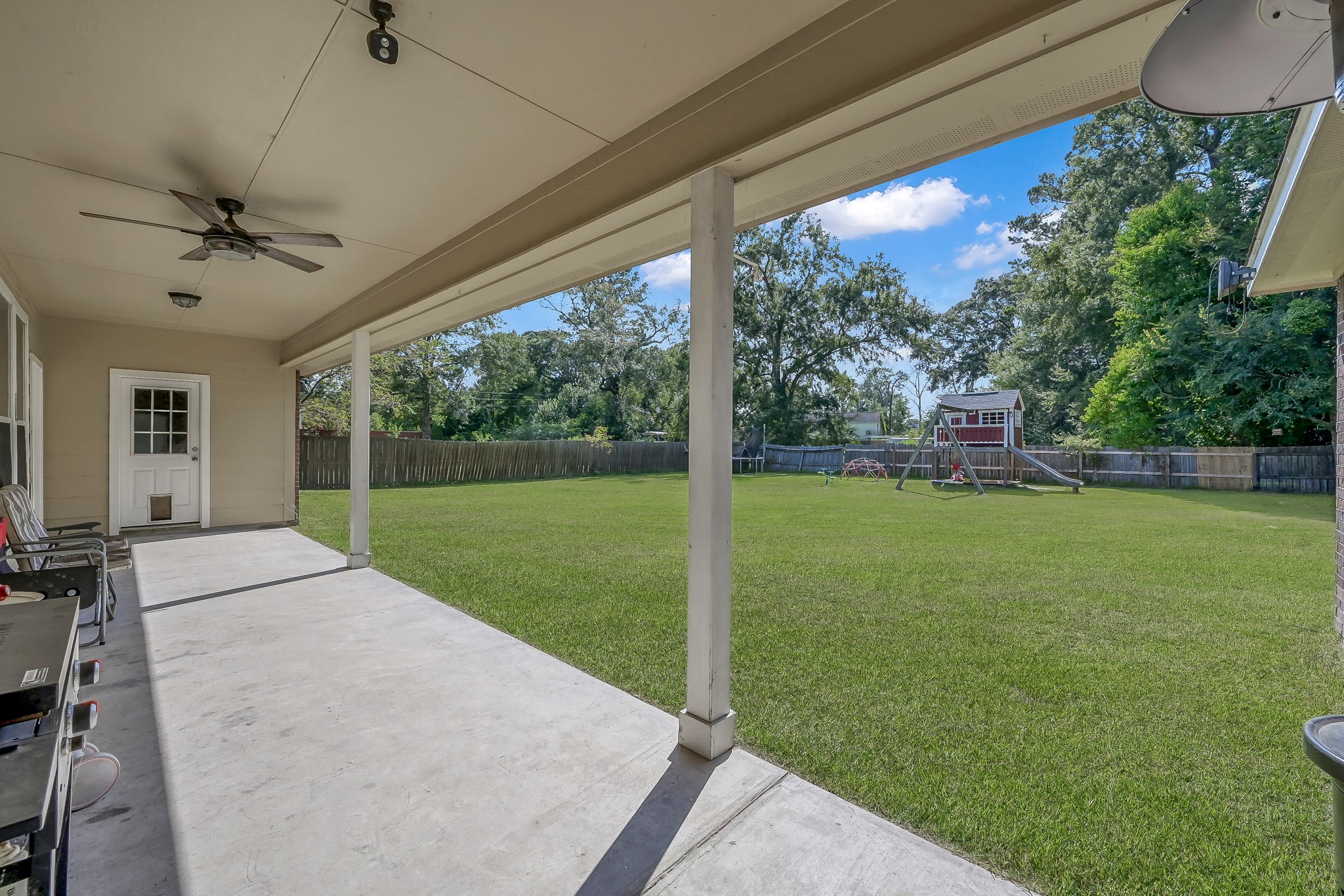 409 Mildred Street Cleveland, TX 77328 - Photo 19 of 24 a view of a porch with a backyard