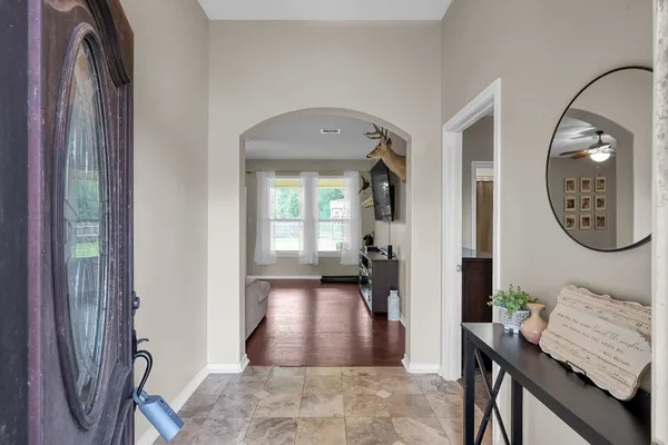 a view of a hallway with elevator and mirror