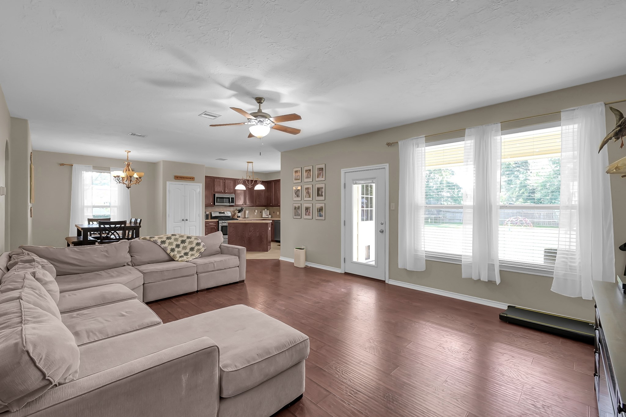 409 Mildred Street Cleveland, TX 77328 - Photo 4 of 24 a living room with furniture and a large window