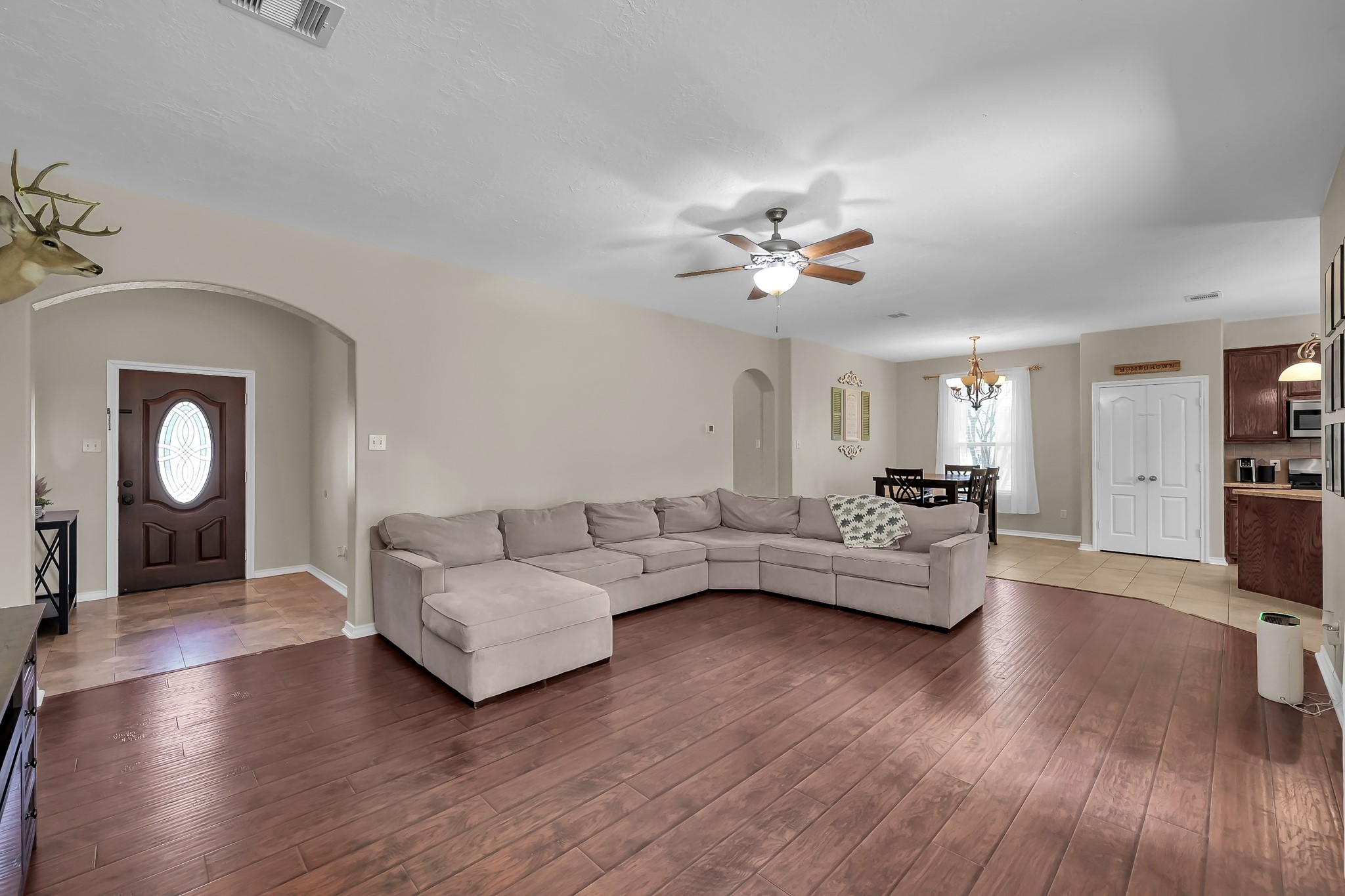 409 Mildred Street Cleveland, TX 77328 - Photo 24 of 24 a living room with furniture and a wooden floor
