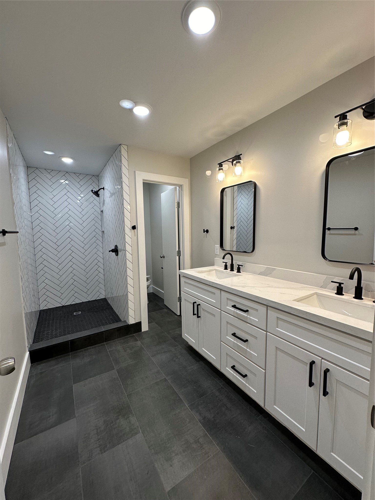 71 Castaway Lane Coldspring, TX 77331 - Photo 14 of 15 Primary bathroom with double sinks and walk in shower