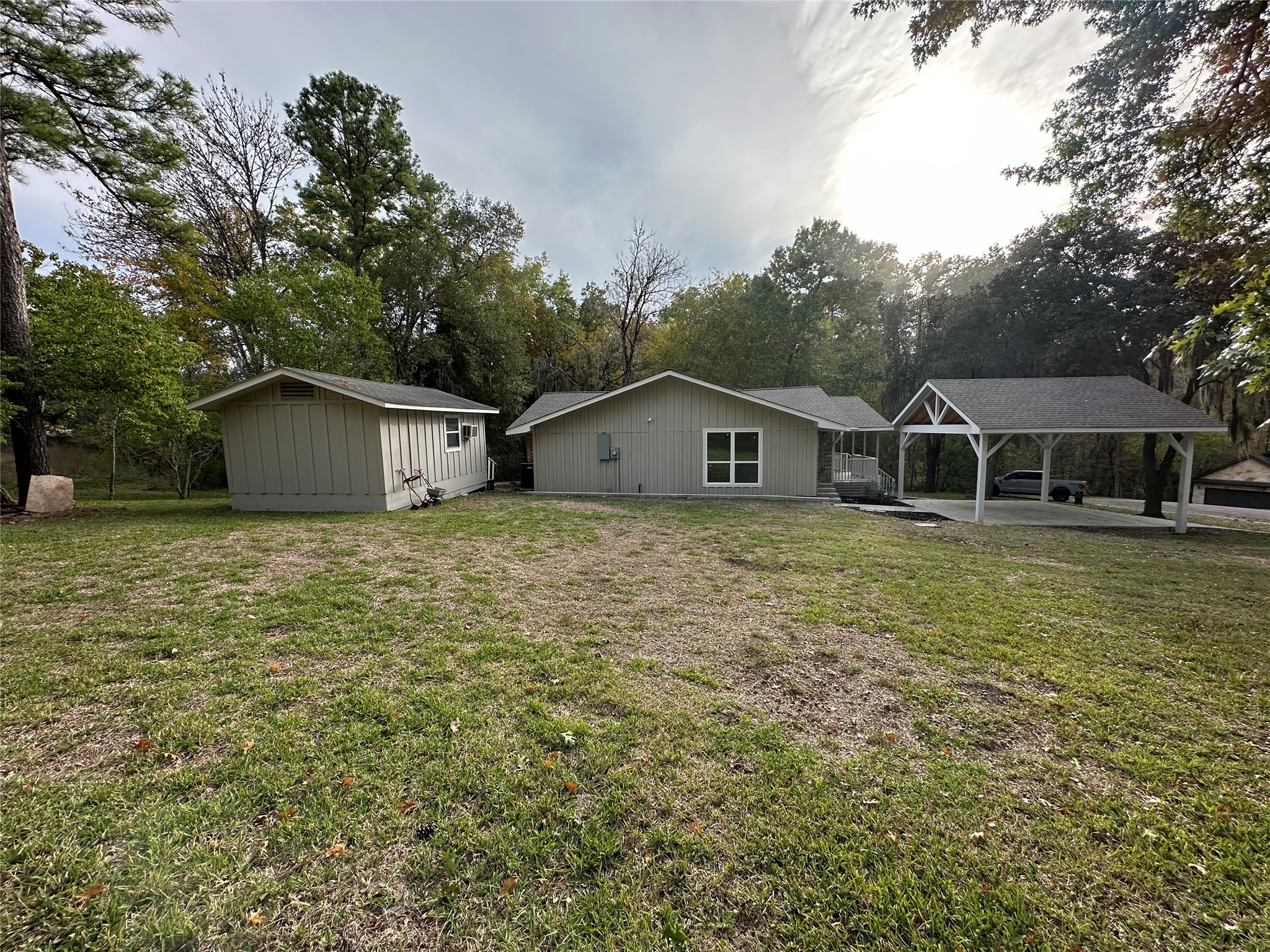 71 Castaway Lane Coldspring, TX 77331 - Photo 6 of 15 Large yard with the storage unit in the back