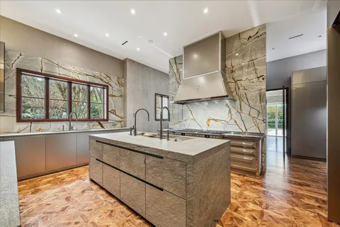 a large kitchen with a table and chairs