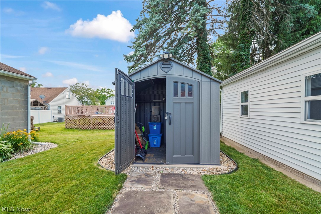 629 Clinton Street Niles, OH 44446 - Photo 8 of 50 Freestanding storage shed with a peaked roof and transom window details on a cement pad