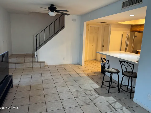 a view of a livingroom with furniture and entryway
