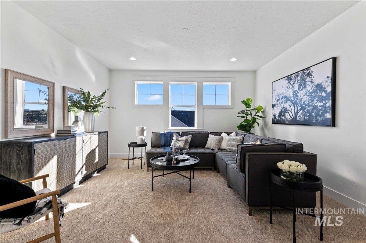 8150 West Gallup Street Meridian, ID 83646 - Photo 12 of 30 Carpeted living area with recessed lighting and baseboards