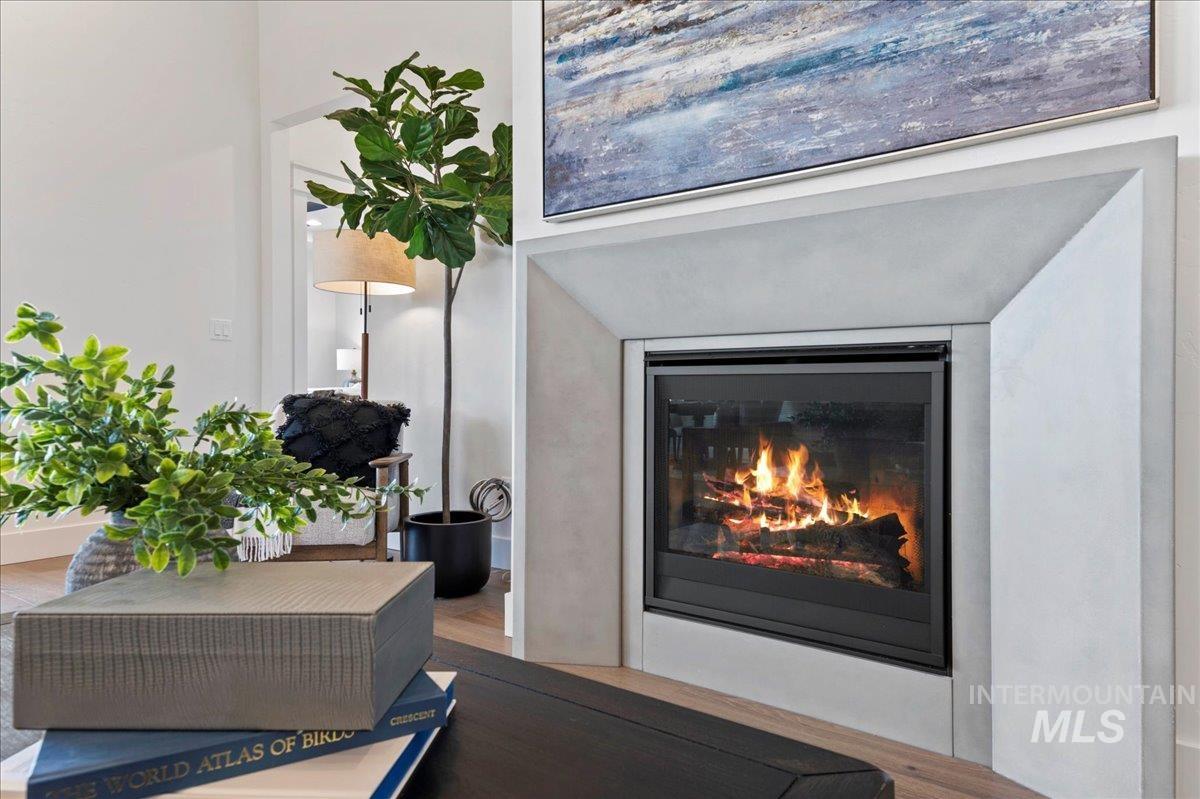 8150 West Gallup Street Meridian, ID 83646 - Photo 15 of 30 Detailed view of wood finished floors and a glass covered fireplace