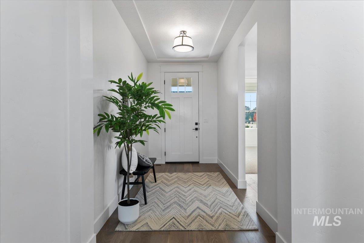 8150 West Gallup Street Meridian, ID 83646 - Photo 4 of 30 Entrance foyer with wood finished floors and baseboards