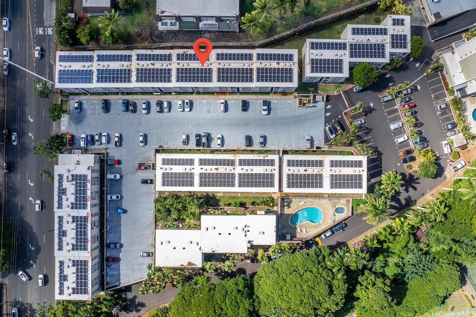 98-1030 Moanalua Road, Unit 5308 Aiea, HI 96701 - Photo 14 of 16 a view of a buildings and cars park