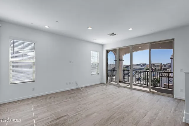 a kitchen with stainless steel appliances a refrigerator a sink a stove a microwave and cabinets