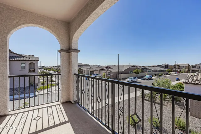 a kitchen with stainless steel appliances granite countertop a refrigerator a stove a microwave oven and white cabinets