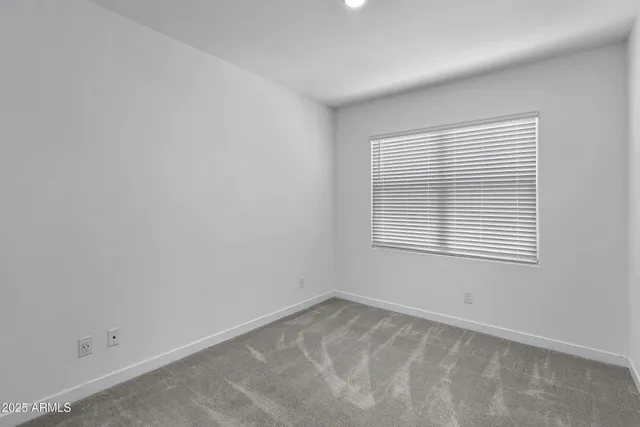 a bathroom with a sink toilet vanity and shower