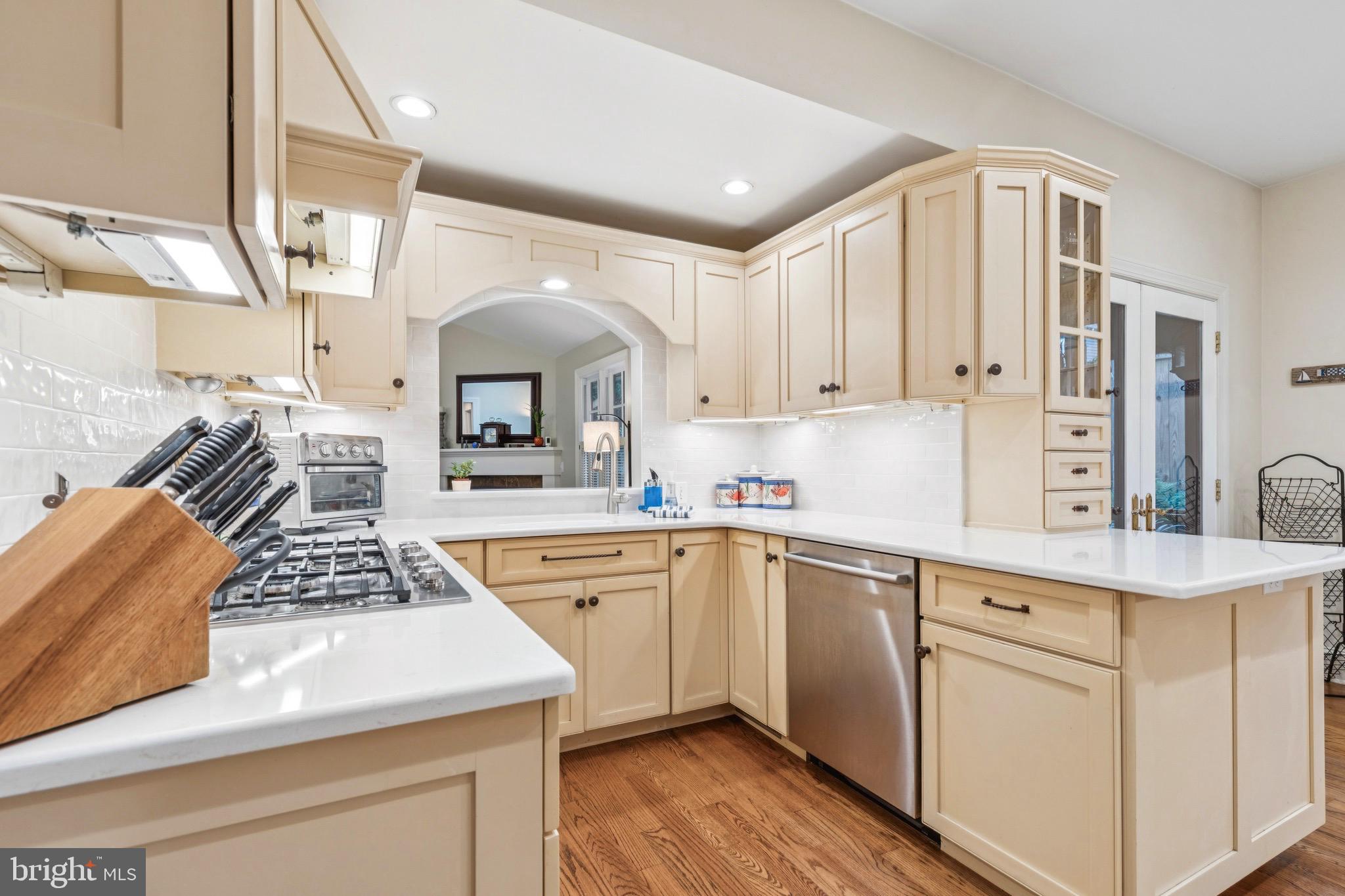 9 Tolson Street Annapolis, MD 21401 - Photo 22 of 82 a kitchen with a sink stove and cabinets