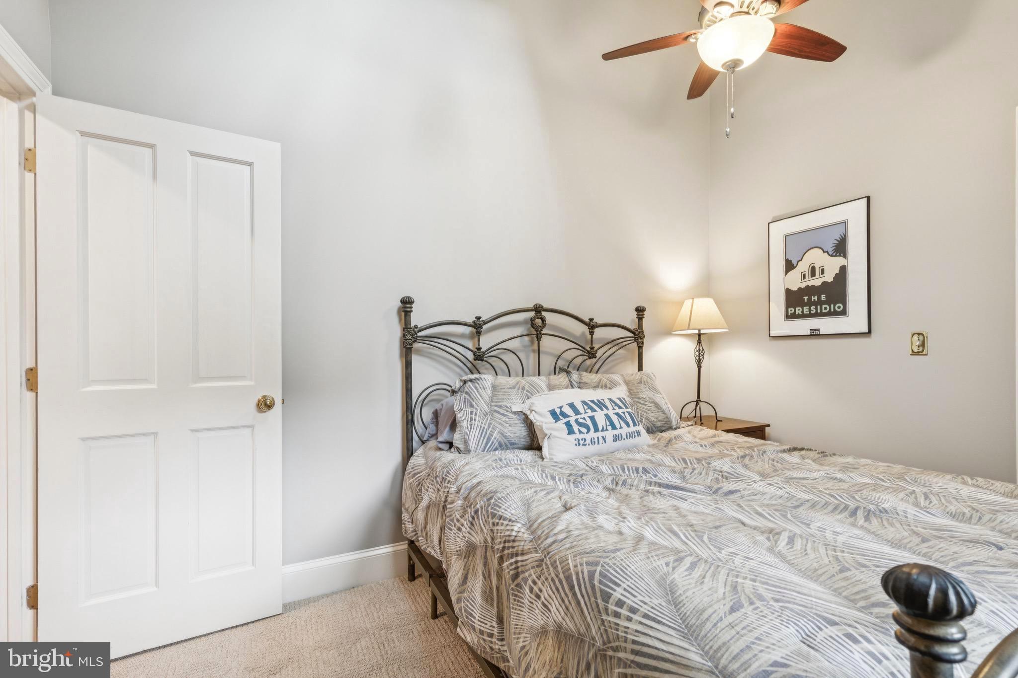 9 Tolson Street Annapolis, MD 21401 - Photo 36 of 82 a bedroom with a bed and a chandelier