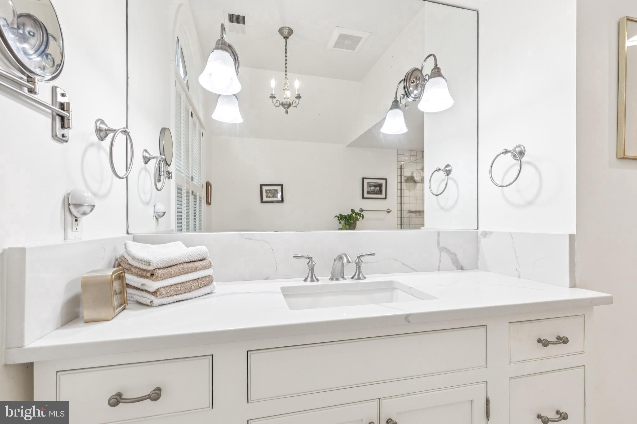 9 Tolson Street Annapolis, MD 21401 - Photo 53 of 82 a bathroom with a sink vanity and a mirror