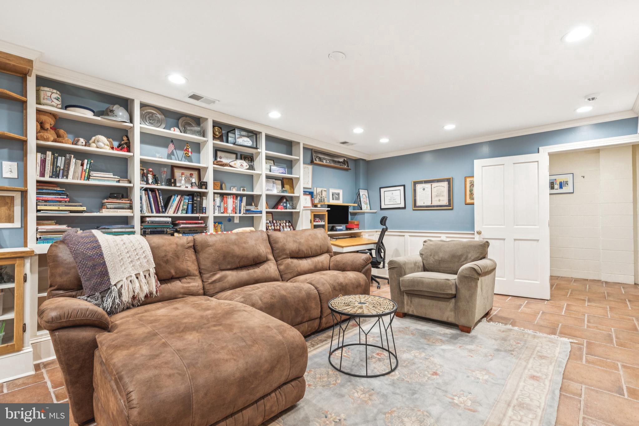 9 Tolson Street Annapolis, MD 21401 - Photo 60 of 82 a living room with furniture and a book shelf