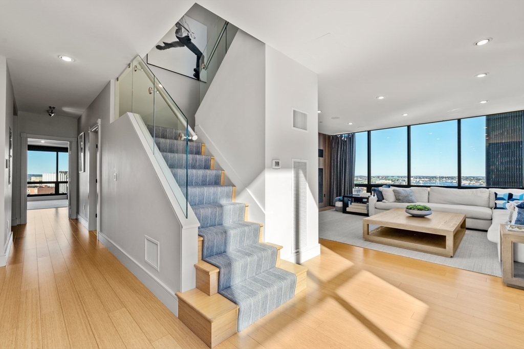 45 Province Street, Unit 2404 Boston, MA 02108 - Photo 11 of 32 a living room with furniture and wooden floor