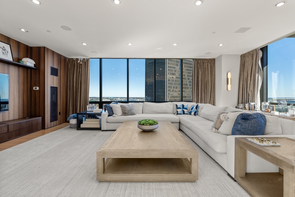 45 Province Street, Unit 2404 Boston, MA 02108 - Photo 3 of 32 a living room with furniture and a large window
