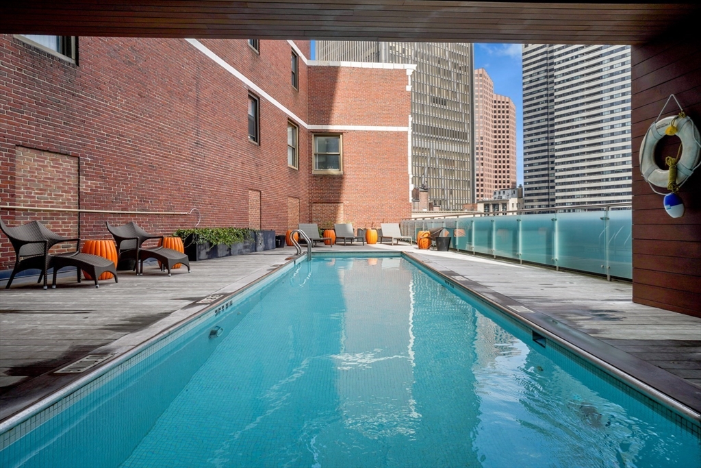 45 Province Street, Unit 2404 Boston, MA 02108 - Photo 31 of 32 a view of a swimming pool with a patio
