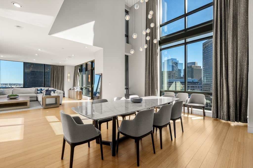 45 Province Street, Unit 2404 Boston, MA 02108 - Photo 5 of 32 a view of a dining room with furniture and wooden floor