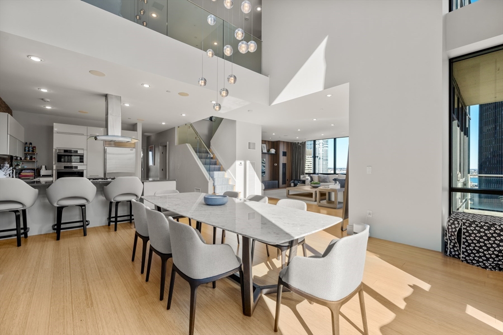 45 Province Street, Unit 2404 Boston, MA 02108 - Photo 6 of 32 a view of a dining room with furniture