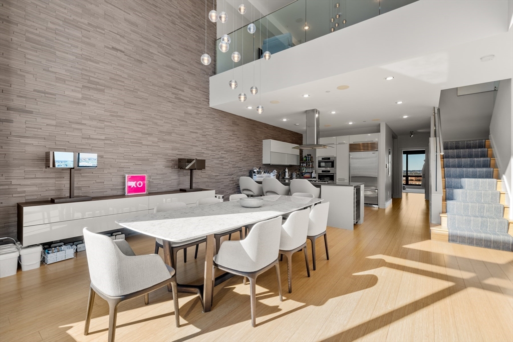 45 Province Street, Unit 2404 Boston, MA 02108 - Photo 7 of 32 a view of a dining room with furniture