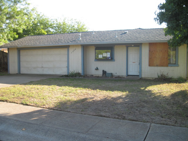 1325 Woodside Meadows Road Redding, CA 96002 - Photo 2 of 12 a front view of a house