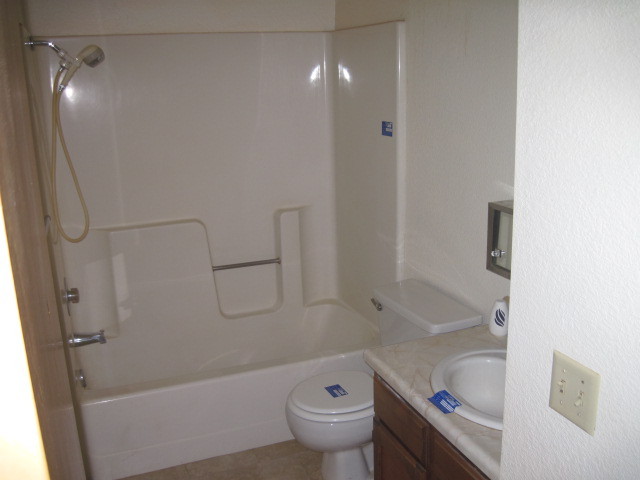 1325 Woodside Meadows Road Redding, CA 96002 - Photo 5 of 12 a bathroom with a sink a toilet and shower