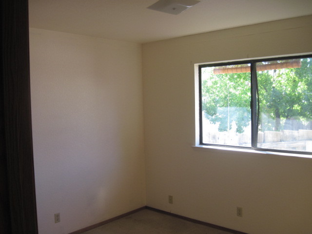 1325 Woodside Meadows Road Redding, CA 96002 - Photo 7 of 12 a view of a room that has a window in it