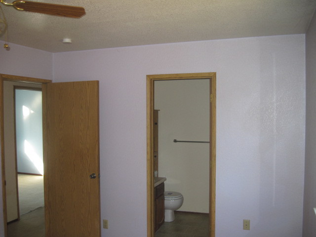 1325 Woodside Meadows Road Redding, CA 96002 - Photo 8 of 12 a bathroom with a granite countertop toilet and a sink
