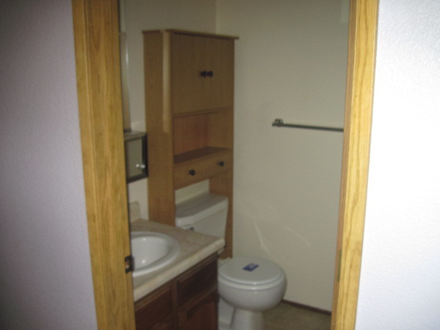 1325 Woodside Meadows Road Redding, CA 96002 - Photo 9 of 12 a bathroom with a sink and toilet