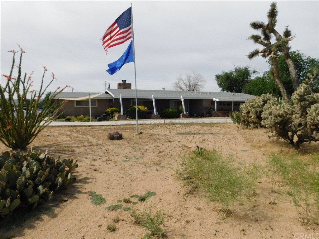 19111 Lenca Road Apple Valley, CA 92307 - Photo 1 of 1 a view of the house with a yard