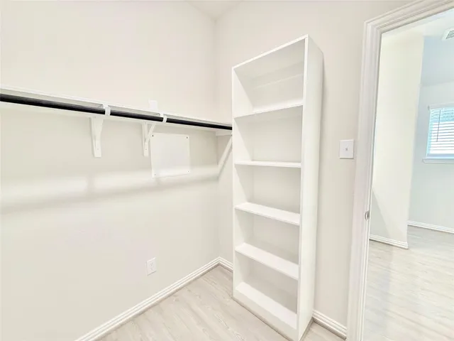 a view of an empty walk in closet