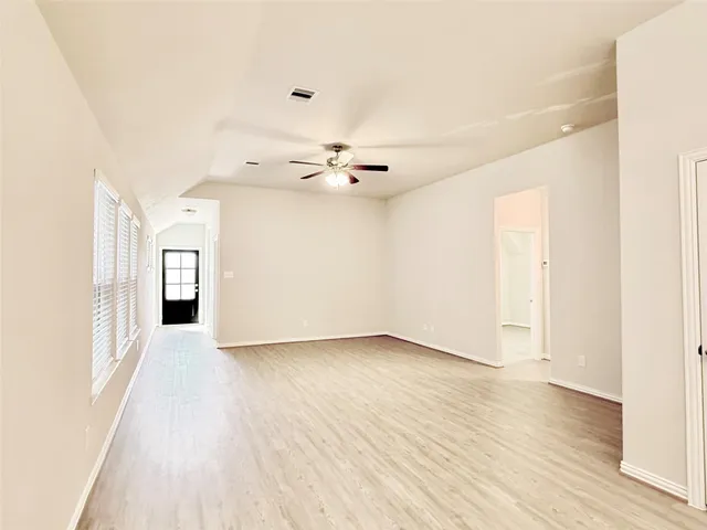 a view of a livingroom with wooden floor