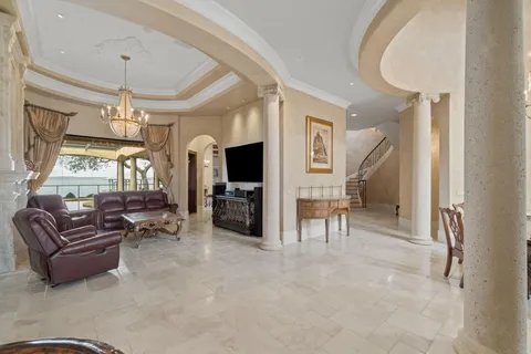 a room with furniture and chandelier