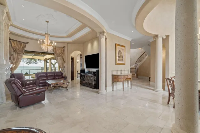 a room with furniture and chandelier