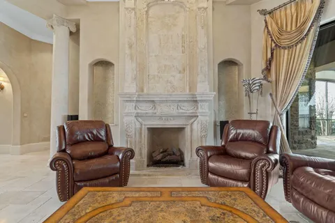 a room with furniture and chandelier