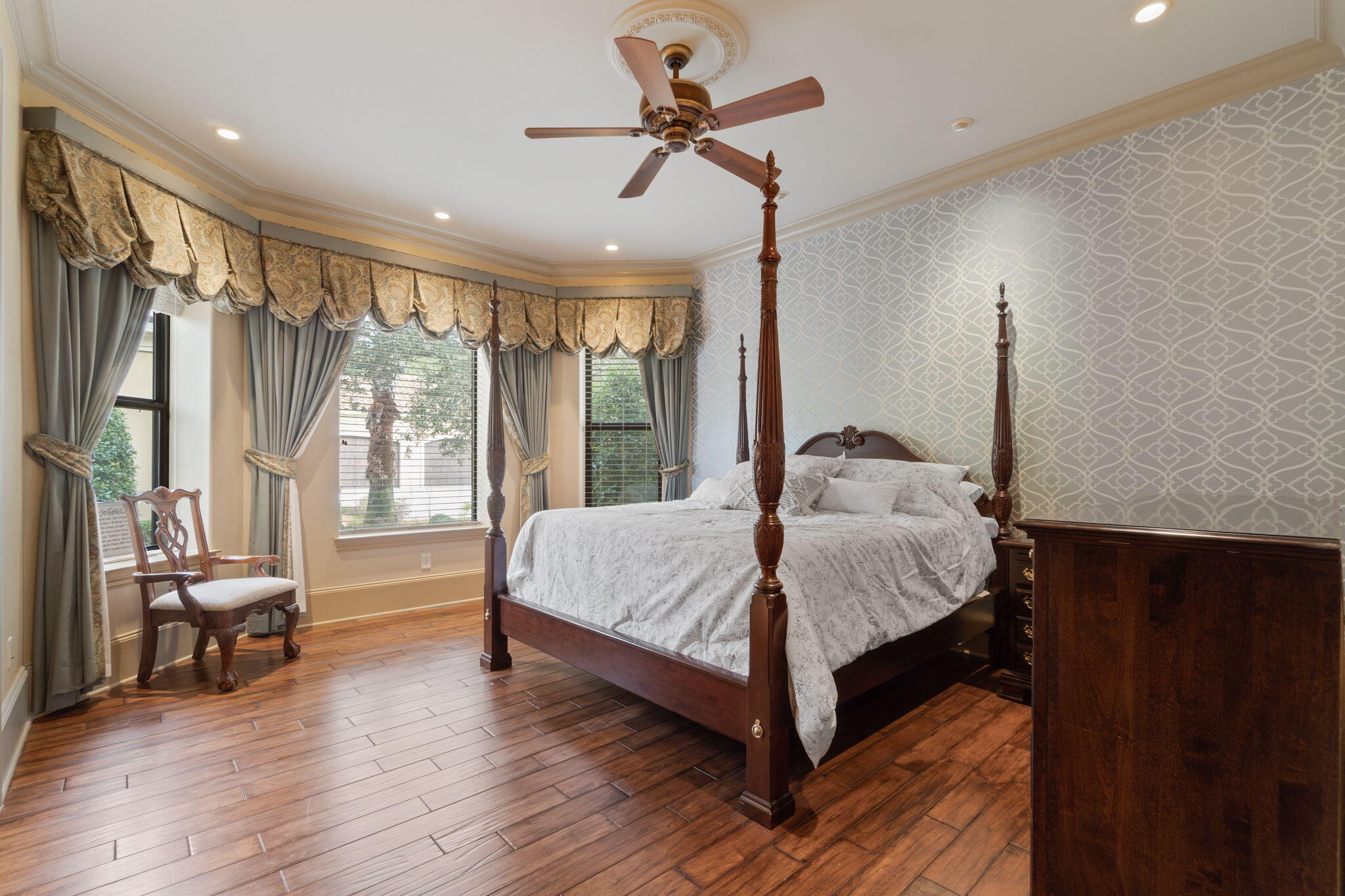 456 Captains Circle Destin, FL 32541 - Photo 16 of 85 a bed sitting in a spacious bedroom next to a window