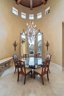 a spacious bathroom with a granite countertop double vanity sink mirror and a bathtub