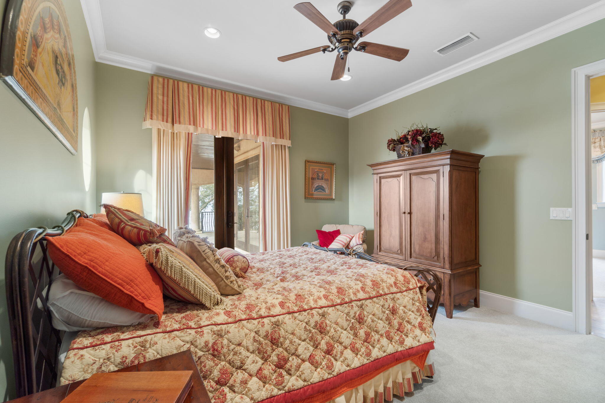 456 Captains Circle Destin, FL 32541 - Photo 43 of 85 a bedroom with a large bed and a chandelier