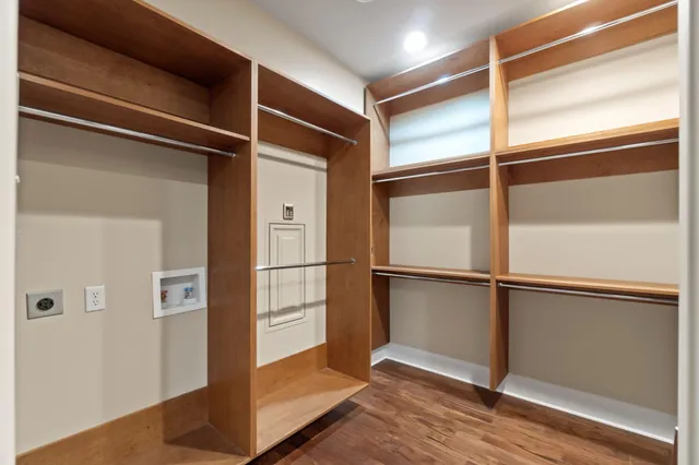 a view of a swimming pool with a bench and trees