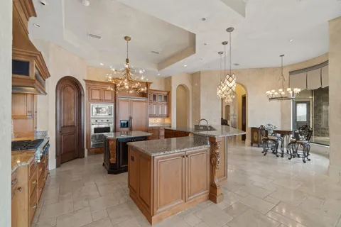 a kitchen with a sink cabinets and window
