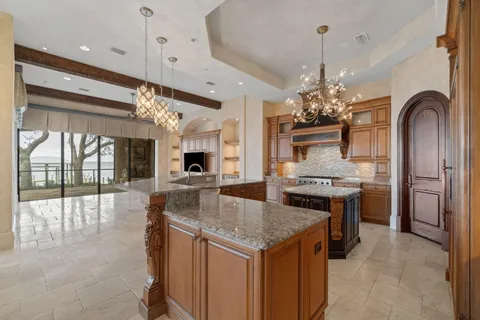 a kitchen with a sink cabinets and window